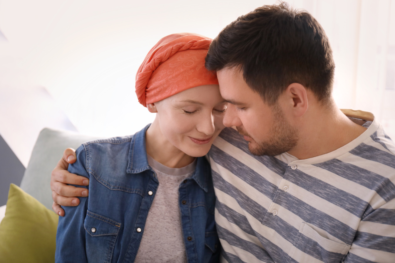 Man Hugging a Person with Cancer